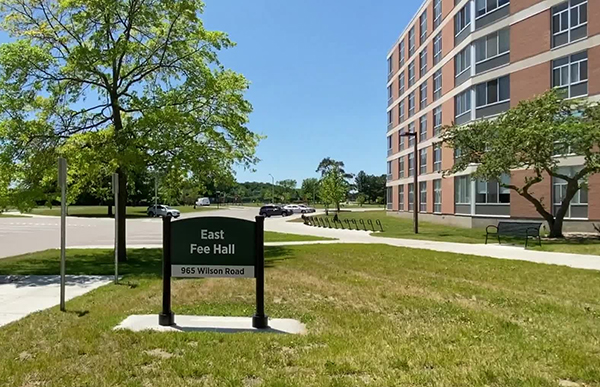 East Fee Hall 965 Wilson Road sign in front of East Fee Hall building entrance